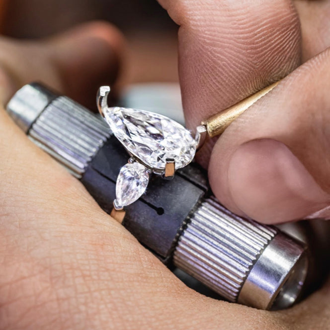 Main and matching diamond setting on an engagement ring followed by polishing for brilliance